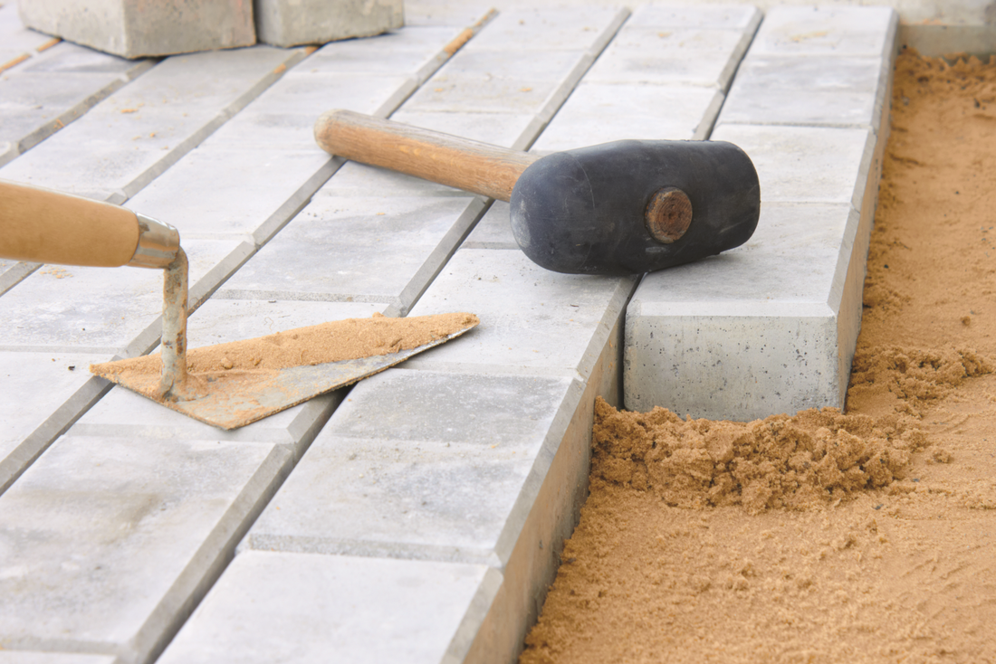 Laying Pavers: Getting the Base Right with Crusher Dust and Sand